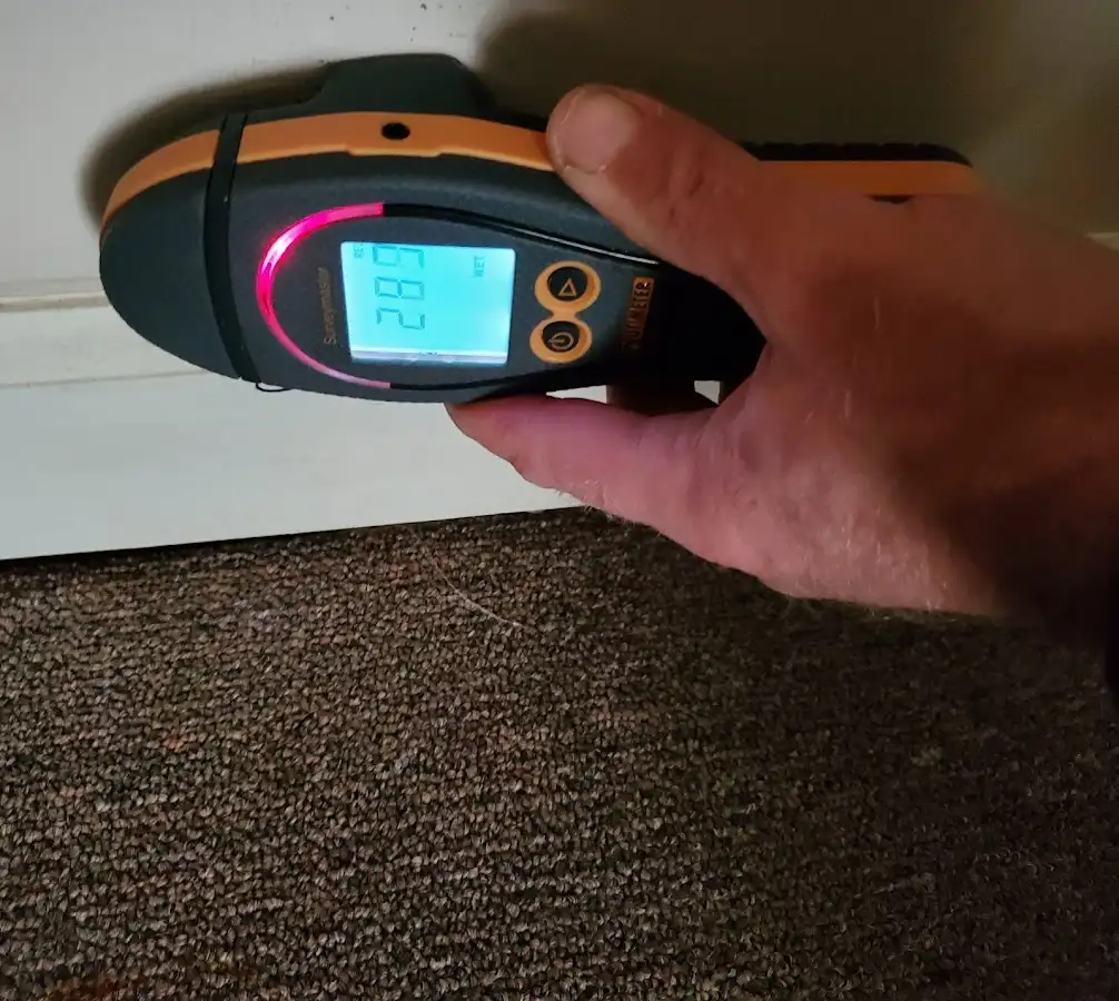 Moisture detection at baseboard during Burst Pipe Cleanup in Ludlow